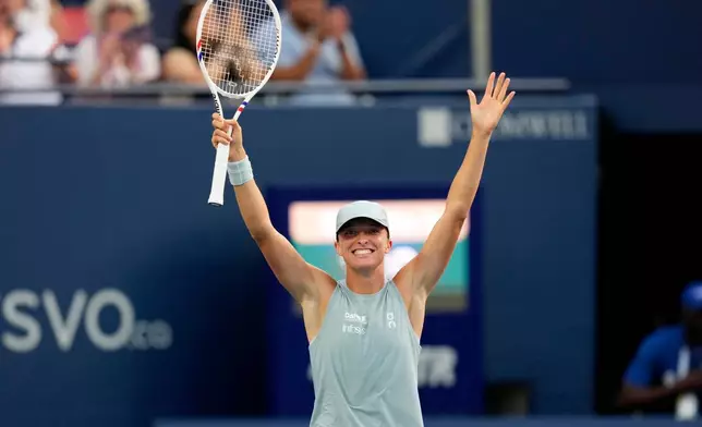 Poland's Iga Swiatek celebrates after defeating Kazakhstan's Elena Rybakina in a National Bank Open final tennis match, in Toronto, Thursday, Aug. 13, 2026. (Chris Young/The Canadian Press via AP)