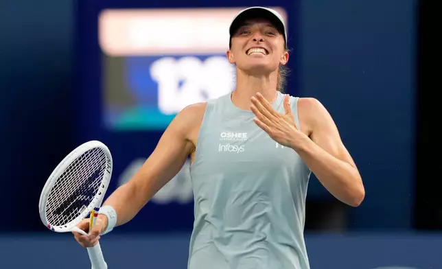 Poland's Iga Swiatek celebrates after defeating Kazakhstan's Elena Rybakina in a National Bank Open final tennis match, in Toronto, Thursday, Aug. 13, 2026. (Chris Young/The Canadian Press via AP)