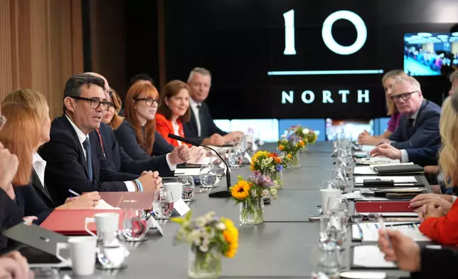 Britain's Prime Minister Andy Burnham, third left, holds a National Economic Council meeting at No 10 North at Heron House in Manchester, England. Friday July 24, 2026. (Christopher Furlong/Pool Photo via AP)