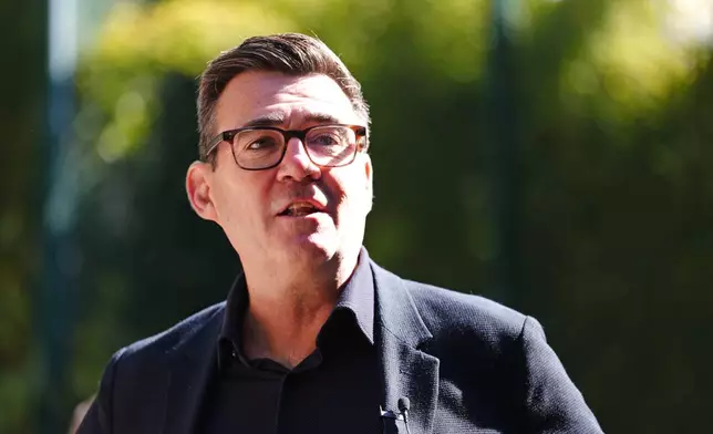 Britain's Prime Minister Andy Burnham during a visit to a family center in Sheffield, England, Friday, July 31, 2026. (Annabel Lee-Ellis/Pool Photo via AP)
