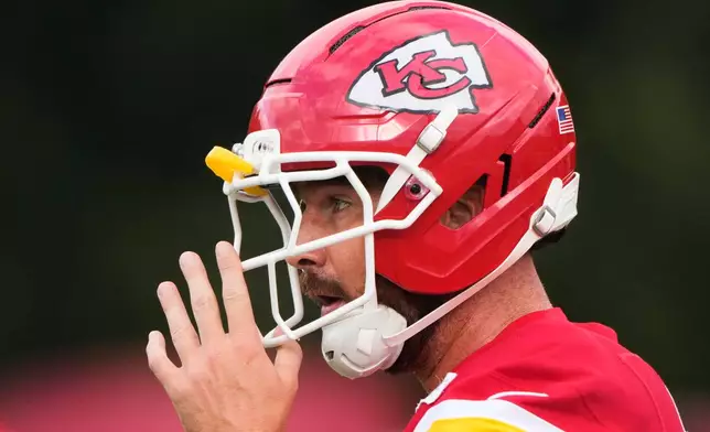 Kansas City Chiefs tight end Travis Kelce talks with a teammate during NFL football training camp Saturday, Aug. 1, 2026, in St. Joseph, Mo. (AP Photo/Charlie Riedel)