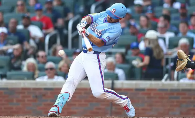 Atlanta Braves' Drake Baldwin hits a single in the third inning of a baseball game against the Colorado Rockies, Saturday, Aug. 29, 2026, in Atlanta. (AP Photo/Colin Hubbard)