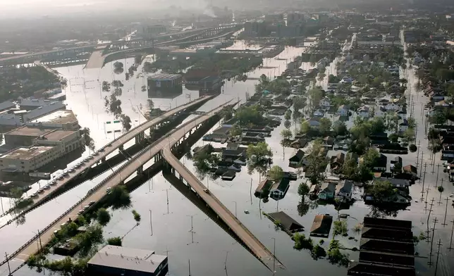 FILE - Floodwaters from Hurricane Katrina fill the streets near downtown New Orleans on Aug. 30, 2005. (AP Photo/David J. Phillip, File)