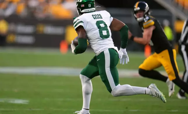 New York Jets safety Andre Cisco (8) runs the ball after intercepting a pass during the first half of an NFL preseason football game against the Pittsburgh Steelers, Friday, Aug. 21, 2026, in Pittsburgh. (AP Photo/Gene J. Puskar)