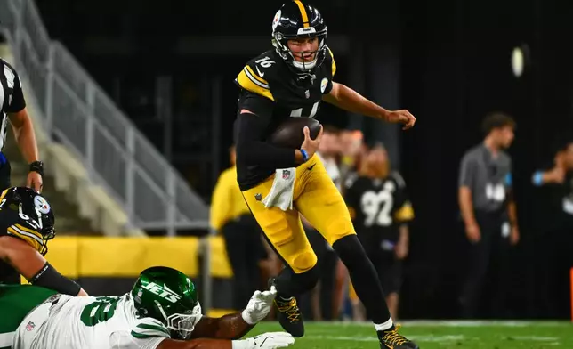 Pittsburgh Steelers quarterback Drew Allar (16) avoids a tackle during the second half of an NFL preseason football game against the New York Jets, Friday, Aug. 21, 2026, in Pittsburgh. (AP Photo/Justin Berl)