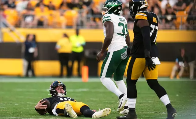 Pittsburgh Steelers quarterback Will Howard, left, reacts after being sacked by New York Jets linebacker David Bailey (31) during the first half of an NFL preseason football game, Friday, Aug. 21, 2026, in Pittsburgh. (AP Photo/Gene J. Puskar)