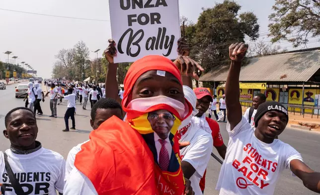 Supporters of Zambian incumbent President and United Party for National Development (UPND) presidential candidate Hakainde Hichilema campaign on the street in Lusaka, Zambia, Monday, Aug. 10, 2026. (AP Photo/Anita Reed)