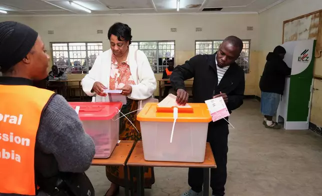 Zambians cast their vote at a polling station during a presidential election in Lusaka, Zambia, Thursday, Aug. 13, 2026. (AP Photo/Anita Reed)