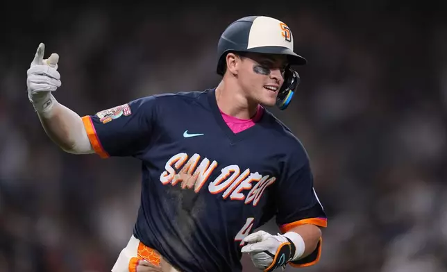 San Diego Padres' Jase Bowen celebrates after hitting a home run during the fourth inning of a baseball game against the San Francisco Giants Friday, July 31, 2026, in San Diego. (AP Photo/Gregory Bull)