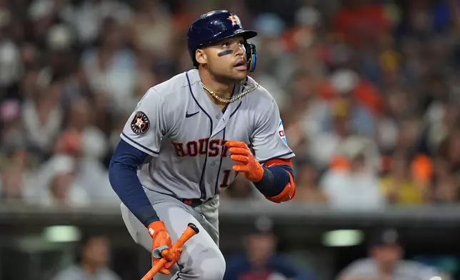 Houston Astros' Cam Smith watches his single during the eighth inning of a baseball game against the San Diego Padres Friday, Aug. 7, 2026, in San Diego. (AP Photo/Gregory Bull)