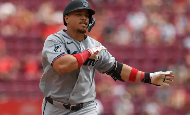Miami Marlins' Heriberto Hernández rounds the bases after hitting a solo home run during the eighth inning of a baseball game against the Cincinnati Reds, Sunday, Aug. 16, 2026, in Cincinnati. (AP Photo/Tanner Pearson)