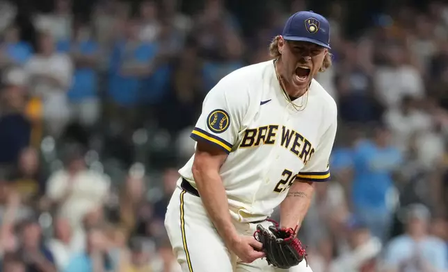 Milwaukee Brewers' Trevor Megill reacts after recording a save during the ninth inning of a baseball game against the Pittsburgh Pirates, Wednesday, Aug. 5, 2026, in Milwaukee. (AP Photo/Aaron Gash)