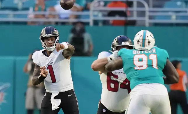Atlanta Falcons quarterback Tua Tagovailoa (1) passes against the Miami Dolphins during the first half of an NFL preseason football game, Friday, Aug. 28, 2026, in Miami Gardens, Fla. (AP Photo/Lynne Sladky)