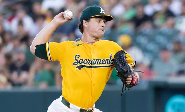 Athletics pitcher J.T. Ginn throws to the Texas Rangers during the third inning of a baseball game Saturday, Aug. 15, 2026, in West Sacramento, Calif. (AP Photo/Sara Nevis)
