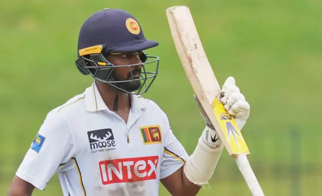 Sri Lanka's Pasindu Sooriyabandara celebrates his fifty runs during day three of the second cricket test match between Sri Lanka and India in Colombo, Sri Lanka, Tuesday, Aug. 25, 2026. (AP Photo/Eranga Jayawardena)