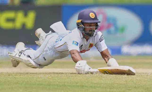 Sri Lanka's Pasindu Sooriyabandara makes successfully into the crease during day three of the second cricket test match between Sri Lanka and India in Colombo, Sri Lanka, Tuesday, Aug. 25, 2026. (AP Photo/Eranga Jayawardena)