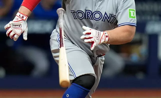 Toronto Blue Jays' Alejandro Kirk watches his RBI single off Tampa Bay Rays pitcher Nick Martinez during the fourth inning of a baseball game Tuesday, Aug. 18, 2026, in St. Petersburg, Fla. (AP Photo/Chris O'Meara)