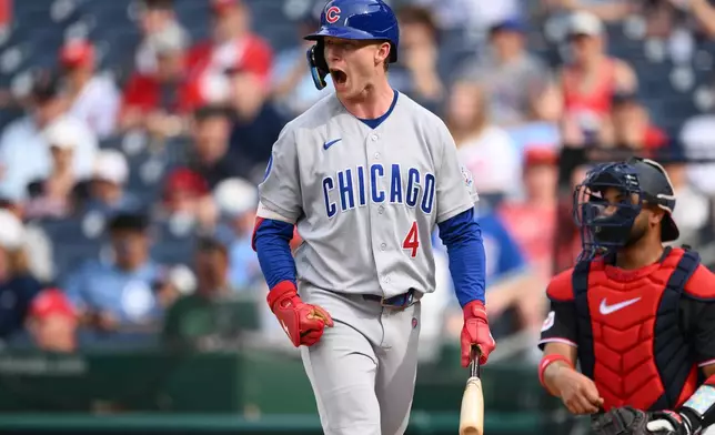 Chicago Cubs' Pete Crow-Armstrong (4) reacts after the struck out during the fourth inning of a baseball game next to Washington Nationals catcher Keibert Ruiz, right, Thursday, Aug. 13, 2026, in Washington. (AP Photo/Nick Wass)