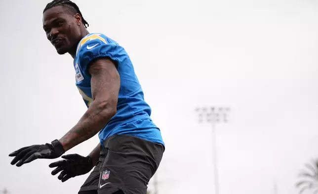 Los Angeles Chargers safety Derwin James Jr. runs through a drill during an NFL football training camp Wednesday, Aug. 5, 2026, in San Diego. (AP Photo/Gregory Bull)