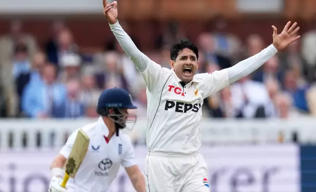 Pakistan's Mohammad Abbas appeals successfully for the wicket of England's Ben Duckett, standing behind him, during the second cricket test match between England and Pakistan in London, Thursday, Aug. 27, 2026. (AP Photo/Dave Shopland)