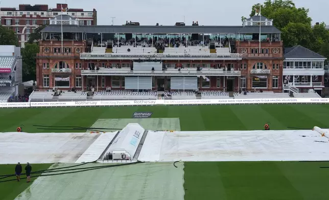 Rain covers are on the playing surface at the Lord's cricket ground ahead of the second cricket test match between England and Pakistan in London, Thursday, Aug. 27, 2026. (AP Photo/Dave Shopland)