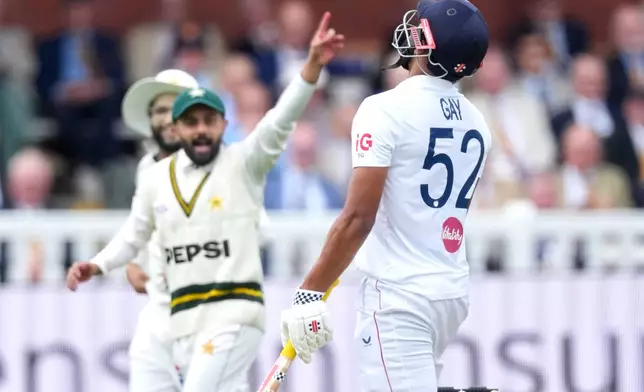 England's Emilio Gay, right, reacts after losing his wicket during the second cricket test match between England and Pakistan in London, Thursday, Aug. 27, 2026. (AP Photo/Dave Shopland)