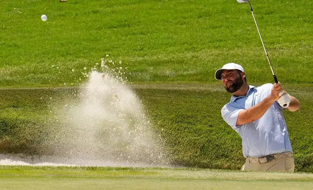 Scottie Scheffler hits from a bunker to the eighth green during the final round of the St. Jude Championship golf tournament, Sunday, Aug. 16, 2026, in Memphis, Tenn. (AP Photo/George Walker IV)