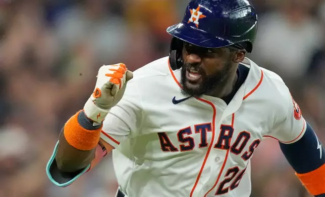 Houston Astros' Taylor Trammell celebrates after hitting a two-run single against the Texas Rangers during the third inning of a baseball game Saturday, Aug. 1, 2026, in Houston. (AP Photo/David J. Phillip)