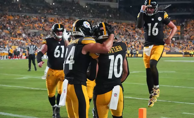 Pittsburgh Steelers running back Max Hurleman, left, wide receiver Kaden Wetjen (10) and quarterback Drew Allar (16) celebrate Wetjen's touchdown catch in the second half of a preseason NFL football game against the Green Bay Packers in Pittsburgh, Thursday, Aug. 13, 2026. (AP Photo/Gene J. Puskar)