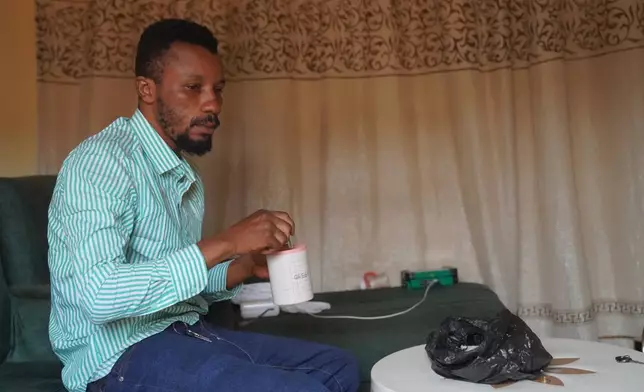 Wiza Bondele, a health worker on the prevention and control team, seen at his home in Ituri province, eastern Congo, Wednesday, Aug 5, 2026. (AP Photo/Dieudonne Dirole)