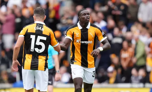 Hull City's Nobel Mendy, right, celebrates scoring during the English Premier League soccer match between Hull City and Manchester United in Kingston upon Hull, England, Saturday Aug. 22, 2026. (Annabel Lee-Ellis/PA via AP)