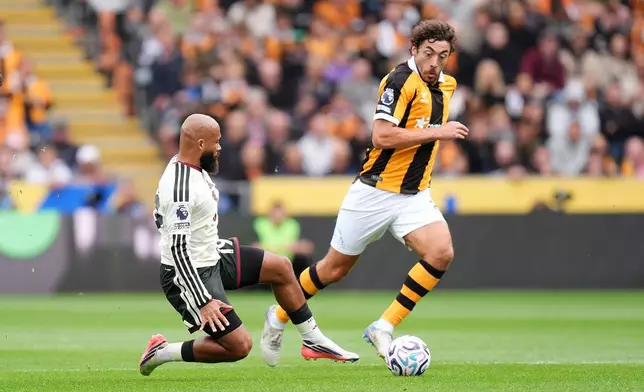 Manchester United's Bryan Mbeumo, left, and Hull City's Matt Crooks in action during the English Premier League soccer match between Hull City and Manchester United in Kingston upon Hull, England, Saturday Aug. 22, 2026. (Annabel Lee-Ellis/PA via AP)