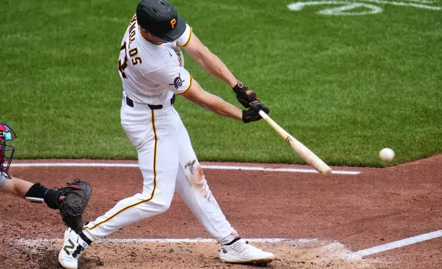 Pittsburgh Pirates' Bryan Reynolds drives in a run with a single off Boston Red Sox pitcher Patrick Sandoval during the third inning of a baseball game in Pittsburgh, Sunday, Aug. 16, 2026. (AP Photo/Gene J. Puskar)