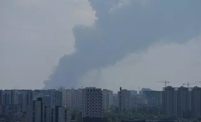Smoke rises over the city center after a Russian attack on Kyiv, Ukraine, Thursday, Aug. 27, 2026. (AP Photo/Efrem Lukatsky)