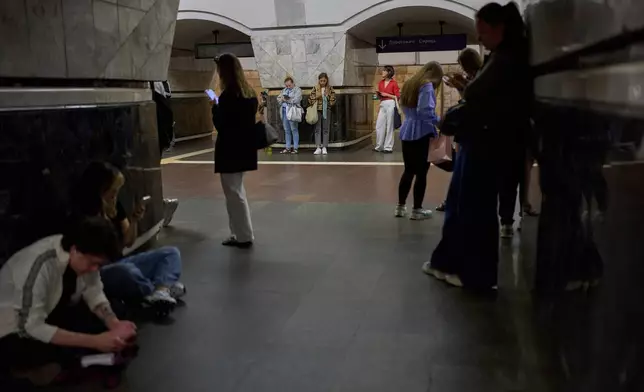 Commuters shelter at Palats Sportu metro station during an air raid alarm in Kyiv, Ukraine, Thursday, Aug. 27, 2026. (AP Photo/Francisco Seco)