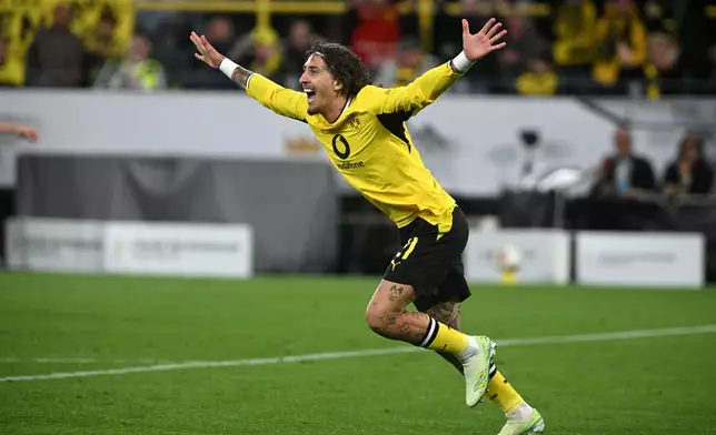 Dortmund's Fabio Silva celebrates scoring his side's first goal during the Franz Beckenbauer German Supercup soccer match between Borussia Dortmund and Bayern Munich in Dortmund, Germany, Saturday, Aug. 22, 2026. (Bernd Thissen/dpa via AP)