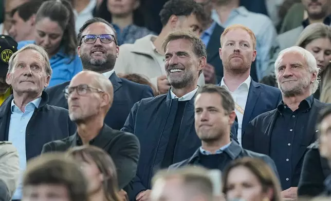 Germany's new head coach Juergen Klopp, center, attends the Franz Beckenbauer German Supercup soccer match between Borussia Dortmund and Bayern Munich in Dortmund, Germany, Saturday, Aug. 22, 2026. (AP Photo/Martin Meissner)