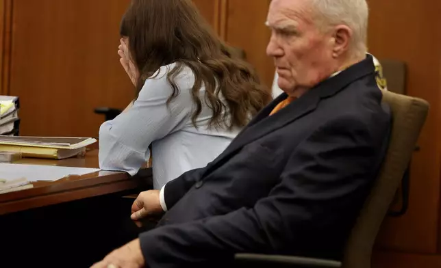 Defense attorney Kevin Reddington and Lindsay Clancy listen to the 911 recording from Jan. 24, 2023, during Clancy's murder trial at Plymouth Superior Court in Plymouth, Mass., on Wednesday, July 29, 2026. (David L. Ryan/The Boston Globe via AP, Pool)