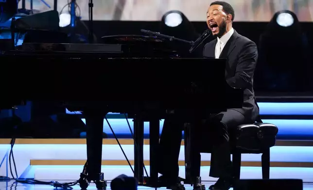 FILE - John Legend performs 'Hero' during MusiCares Person of the Year honoring Mariah Carey on Jan. 30, 2026, in Los Angeles. (AP Photo/Chris Pizzello, File)