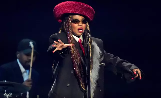 FILE - Singer Lauryn Hill performs during the draw for the 2026 soccer World Cup at the Kennedy Center in Washington, Dec. 5, 2025. (AP Photo/Chris Carlson, File)