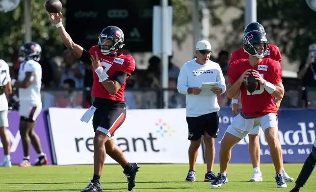 Houston Texans quarterback C.J. Stroud (7) and quarterback Davis Mills (10) work out during a joint practice with the Las Vegas Raiders at the NFL football training camp Tuesday, Aug. 18, 2026, in Houston. (AP Photo/Ashley Landis)