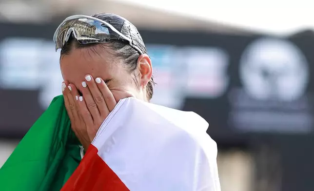Italy's Sofia Fiorini reacts after winning the women's marathon walk at the European Athletics Championships in Birmingham, England, Saturday, Aug. 15, 2026. (AP Photo/Morgan Harlow)