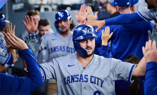 Kansas City Royals' Vinnie Pasquantino (9) celebrates with his team after hitting a two-run home run against the Toronto Blue Jays during sixth inning of a baseball game in Toronto, Thursday, Aug. 27, 2026. (Sammy Kogan/The Canadian Press via AP)