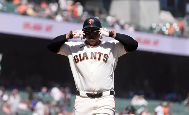 San Francisco Giants' Rafael Devers celebrates after hitting a two-run home run against the Cincinnati Reds during the fifth inning of a baseball game, Wednesday, Aug. 26, 2026, in San Francisco. (AP Photo/Jeff Chiu)
