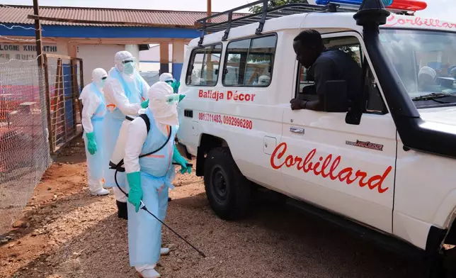 Health workers disinfects an ambulance at Ebola Treatment Center at Bunia General Hospital in Ituri, Congo, Wednesday, July 22, 2026. (AP Photo/Dirole Lotsima Dieudonne)