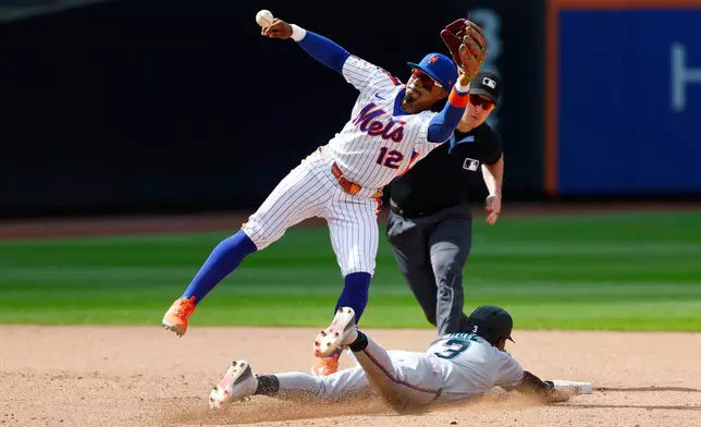 Miami Marlins' Esteury Ruiz (3) steals second base against New York Mets shortstop Francisco Lindor (12) during the eighth inning of a baseball game, Sunday, Aug. 2, 2026, in New York. (AP Photo/Noah K. Murray)