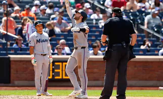 Miami Marlins' Joe Mack, center, reacts after hitting home run against the New York Mets during the fifth inning of a baseball game, Sunday, Aug. 2, 2026, in New York. (AP Photo/Noah K. Murray)