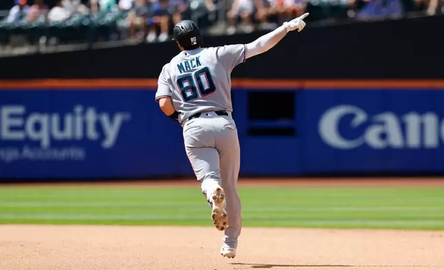 Miami Marlins' Joe Mack reacts while running the bases after hitting home run against the New York Mets during the fifth inning of a baseball game, Sunday, Aug. 2, 2026, in New York. (AP Photo/Noah K. Murray)