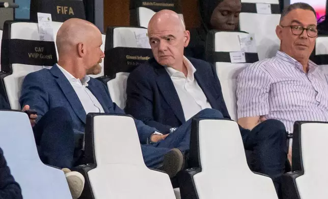 FIFA president Gianni Infantino, center, speaks to FIFA secretary general Mattias Grafstrom, left, sitting beside president of Moroccan Royal Football Federation Fouzi Lekjaa as they attend a Women's AFCON 2026 soccer match between Malawi and Zambia, in Rabat, Morocco, Wednesday, Aug. 5, 2026. (AP Photo)