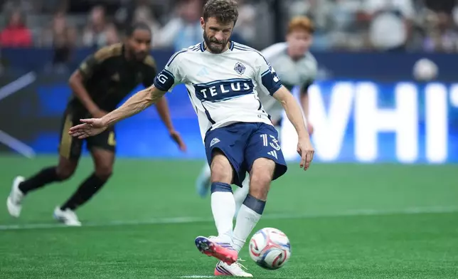 Vancouver Whitecaps' Thomas Muller scores on a penalty kick during the second half of an MLS soccer match against Los Angeles FC, in Vancouver, on Saturday, August 1, 2026. (Darryl Dyck/The Canadian Press via AP)